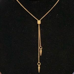 Lariat style necklace, adjustable gold-toned.